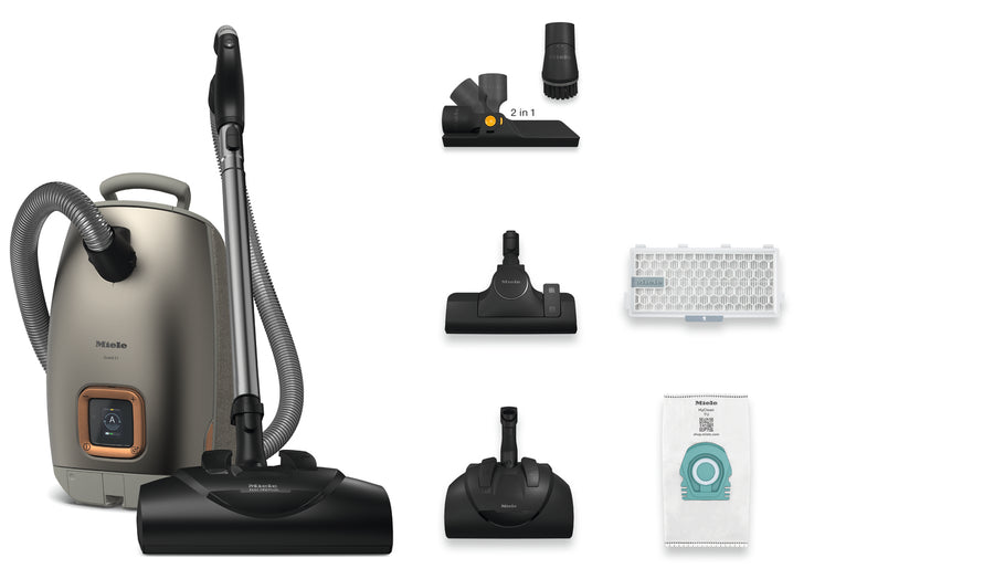 Vacuum cleaner with attachments and filters on a white background
