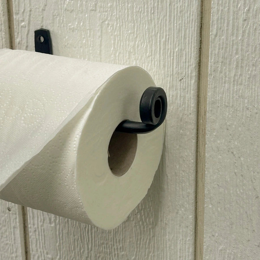 Roll of paper towels mounted on a textured wall