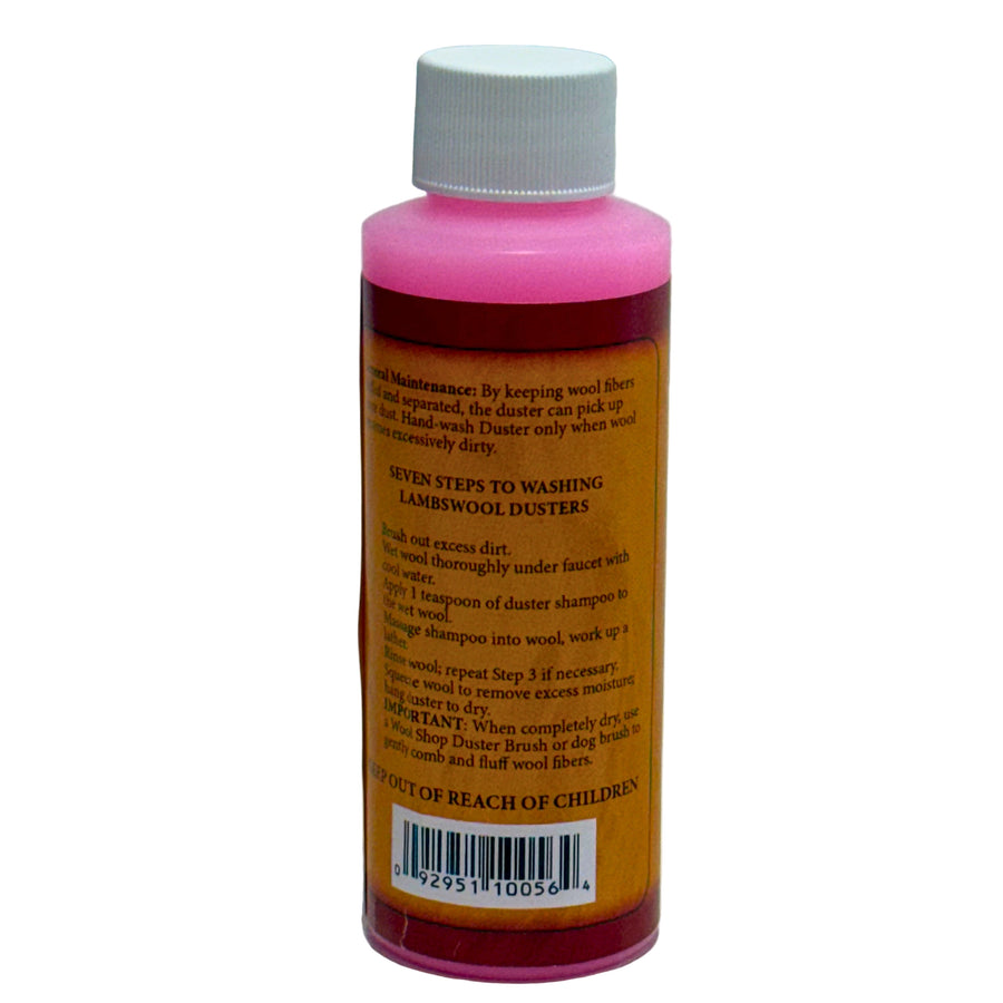 Bottle with pink cap and orange label on a white background